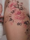 colored-florals-tattoo-on-thigh-by-tritoan_7th-819x1024.jpg