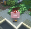 Image I.D: A screenshot of an HD Minecraft skin. It is of the character that is Zenkia Dixon who's appearance has a dark-skinned complexion along with dark grey eyes that seem to have a deep dark grey to shadow them. There are dreadlocs across the front of his face that are light-brown at the tips. His shirt is a light reddish-tan color that has a dark brown and light-tan stripe stretching across his torso along with the sleeves of the long sleeved shirt. His pants seem to be a brownish-grey with black and white shoes that have white laces on them. Near the cuff of his left leg there is a gold bracelet around it. In the background, there is grass and a couple of bushes as he stands near the sand and a pool of water, looking up at the sun.